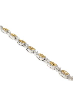 Fancy Yellow Diamond Tennis Bracelet with Halos of White Diamonds in 18k White Gold