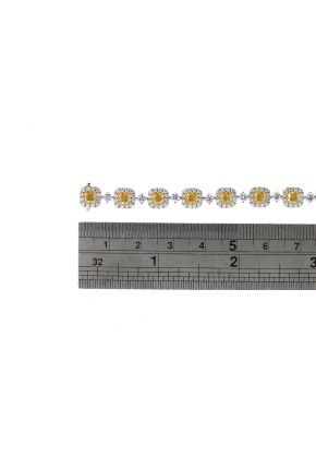 Fancy Yellow Diamond Tennis Bracelet with Halos of White Diamonds in 18k White Gold