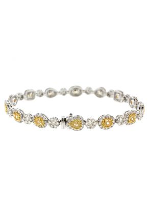 Fancy Yellow Diamond Tennis Bracelet with Halos of White Diamonds in 18k White Gold