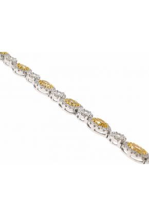 Fancy Yellow Diamond Tennis Bracelet with Halos of White Diamonds in 18k White Gold
