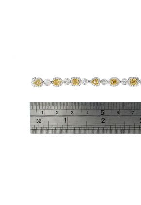 Fancy Yellow Diamond Tennis Bracelet with Halos of White Diamonds in 18k White Gold