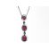 3 Stone Ruby Dangling Pendant with Diamond Halos Around Each & Bezel Set Diamonds In Between Set in 18K White Gold