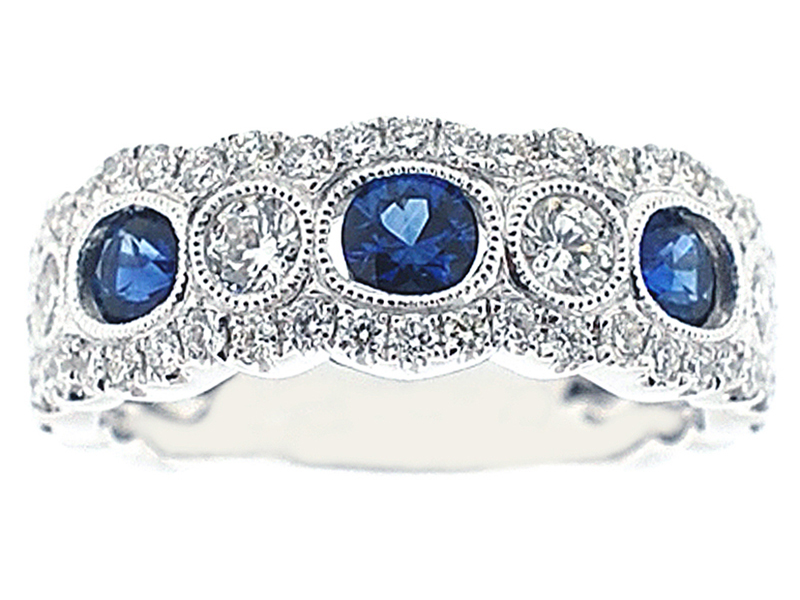 3 Stone Channel Set Sapphire Right Hand Fashion Ring with Bezel Set Diamonds in 18K White Gold