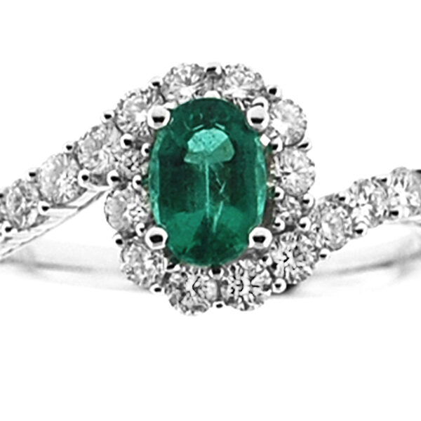 Emerald Twist Ring with Surrounding Diamonds in 18K White Gold