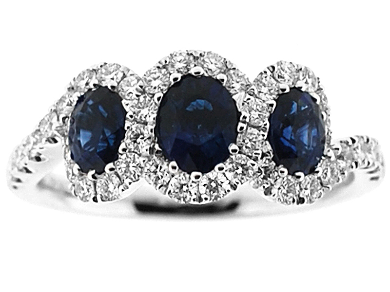 3 Stone Sapphire Twist Ring Surrounded by Diamonds in 18K White Gold