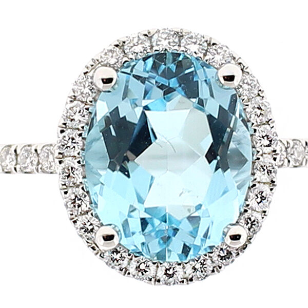 Ladies Oval Aquamarine Ring with Halo of Diamonds in 18k White Gold