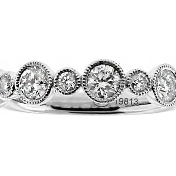 Single Row Small Large Alternating 9 Diamonds Bezel Set in 18kt White Gold