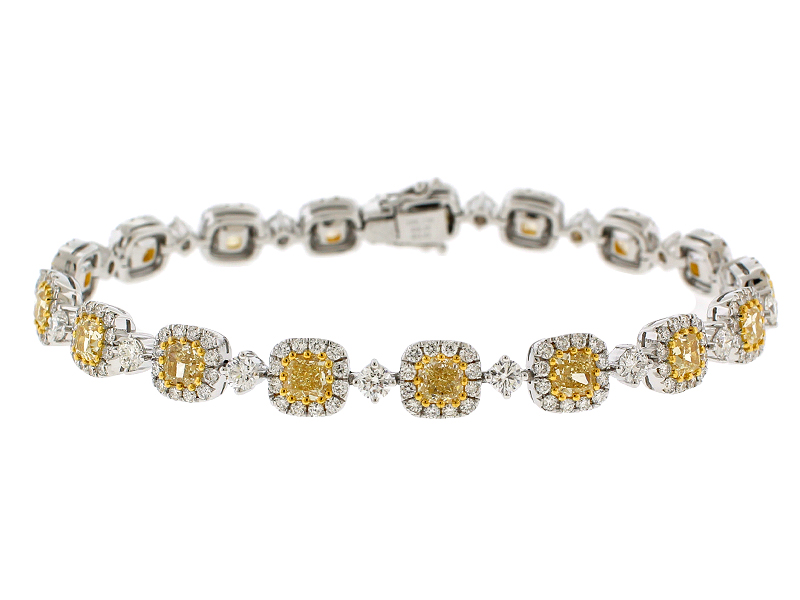 Fancy Yellow Diamond Tennis Bracelet with Halos of White Diamonds in 18k White Gold