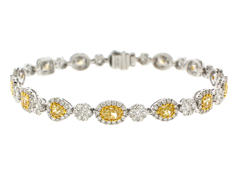 Fancy Yellow Diamond Tennis Bracelet with Halos of White Diamonds in 18k White Gold