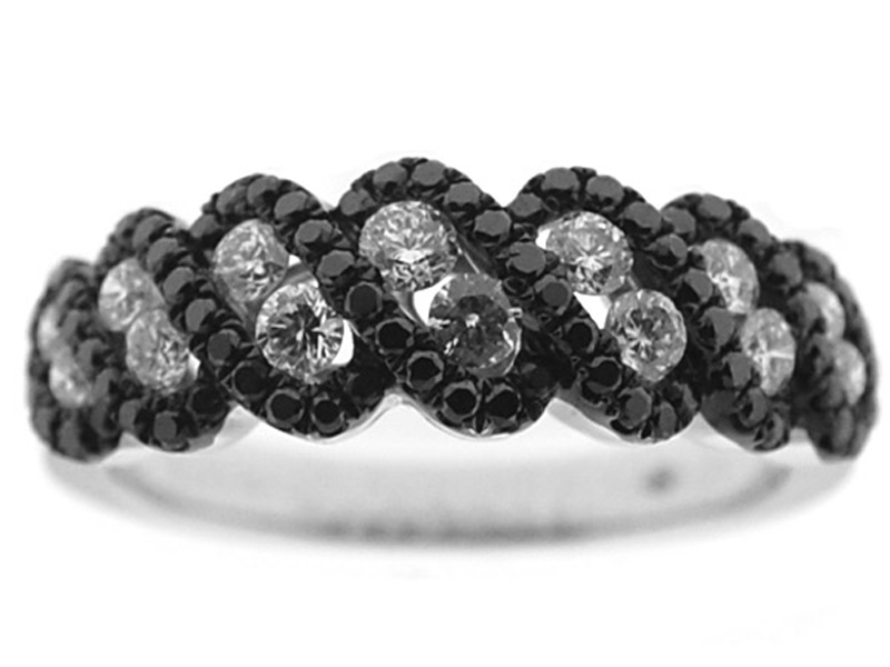Right Hand Fashion Ring with a Swirling Design of Black Diamonds Surrounding White Diamonds Set in 18K White Gold