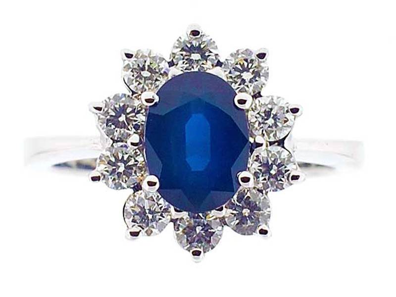 Right Hand Fashion Ring with Sapphire Center Surrounded by Prong Set Diamonds in 18K White Gold